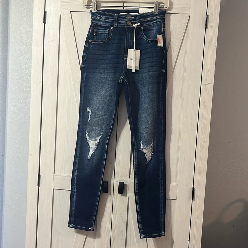 Dark distressed skinny jeans